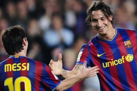 FC Barcelona's Zlatan Ibrahimovic of Sweden, right, reacts after scoring with his teammate Lionel Messi of Argentina against Zaragoza during a Spanish La Liga soccer match at the Camp Nou stadium in Barcelona, Spain, Sunday, Oct. 25, 2009. (AP Photo/Manu Fernandez)