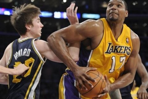 Los Angeles Lakers center Andrew Bynum (17) gets by Utah Jazz forward Gordon Hayward (20) as he looks to the basket in the second half of an NBA basketball game, Tuesday, Jan. 25, 2011, in Los Angeles. The Lakers won 120-91.(AP Photo/Gus Ruelas)