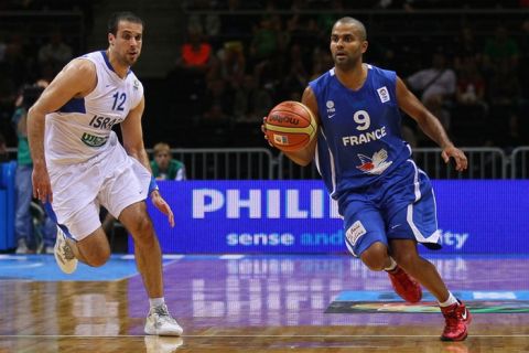 SIAULIAI, LITHUANIA - SEPTEMBER 01: (L-R) Yotam Halperin  of Israel follows  Tony Parker  of France during the EuroBasket 2011 first round group B match between Israel and France at Siauliai Arena on September September 1, 2011 in Siauliai, Lithuania. (Photo by Christof Koepsel/Bongarts/Getty Images)