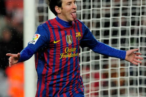 Barcelona's Argentinian forward Lionel Messi celebrates his goal during the Spanish league football match FC Barcelona vs Granada CF on March 20, 2012 at the Camp Nou stadium in Barcelona. AFP PHOTO/ JOSEP LAGO (Photo credit should read JOSEP LAGO/AFP/Getty Images)