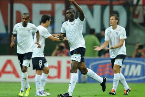 Lazio's forward Djibril Cisse celebrates after scoring against Milan during the Campionato football match between AC Milan and SS Lazio at the San Siro stadium, in Milan, on September 9, 2011. AFP PHOTO / ALBERTO LINGRIA (Photo credit should read ALBERTO LINGRIA/AFP/Getty Images)