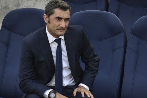 FC Barcelona's head coach Ernesto Valverde looks on prior to the start of the  Spanish La Liga soccer match between Real Sociedad and FC Barcelona at the Anoeta stadium, in San Sebastian, northern Spain, Saturday, Sept. 15, 2018. (AP Photo/Jose Ignacio Unanue)