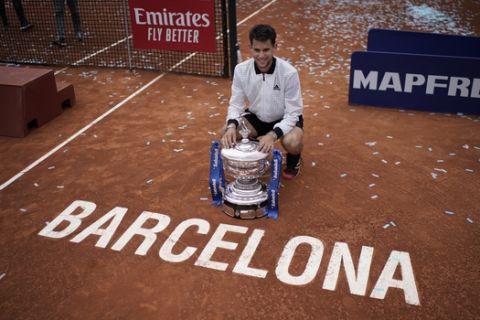 Dominic Thiem of Austria poses with the trophy after winning the final of the Barcelona Open Tennis Tournament against Daniil Medvedev of Russia in two sets 6-4, 6-0, in Barcelona, Spain, Sunday, April 28, 2019. (AP Photo/Felipe Dana)