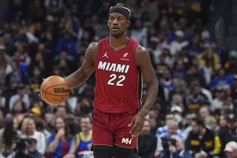 Miami Heat forward Jimmy Butler (22) in the first half of an NBA basketball game Friday, Nov. 8, 2024, in Denver. (AP Photo/David Zalubowski)