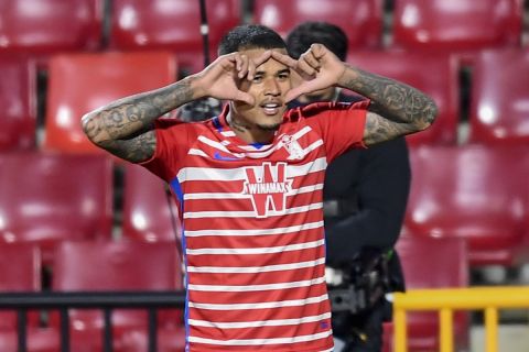 Granada's Kenedy celebrates after scoring a goal during the Europa League, round of 32, first leg soccer match between Granada and Napoli at the Los Carmenes stadium in Granada, Spain, Thursday, Feb. 18, 2021. (AP Photo/Jose Breton)