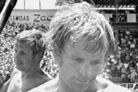 West German team captain Uwe Seeler, second left, hugs team mate Klaus Fichtel after their victory over England, in the Football World Cup quarter final in Leon. Mexico on June 14, 1970. England's Francis Lee, right,  leaves ground dejectedly. West Germany defeated England 3-2 after extra time. (AP Photo/Lohmann)