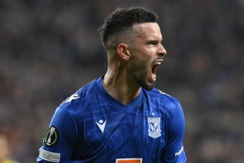 Poznan's Kristoffer Velde celebrates after scoring his sides first goal during the UEFA Europa Conference League group C soccer match between Lech Poznan and Villarreal in Poznan, Poland, Thursday, Nov. 3, 2022. (AP Photo/Adam Nurkiewicz)