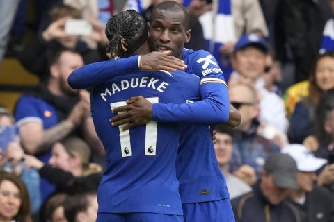 Chelsea's Nicolas Jackson, right, celebrates with Chelsea's Noni Madueke after scoring his side's fourth goal during the English Premier League soccer match between Chelsea and West Ham United at Stamford Bridge stadium in London, England, Sunday, May 5, 2024. (AP Photo/Frank Augstein)