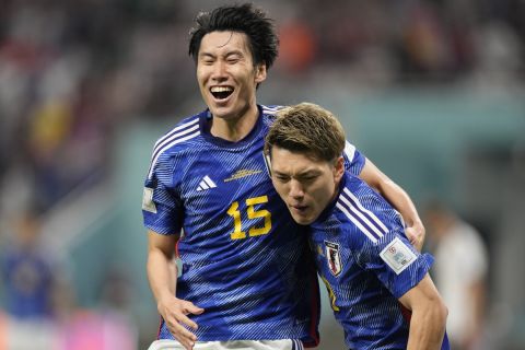 Japan's Ritsu Doan, right, celebrates with Japan's Daichi Kamada after scoring a goal during the World Cup group E soccer match between Germany and Japan, at the Khalifa International Stadium in Doha, Qatar, Wednesday, Nov. 23, 2022. (AP Photo/Luca Bruno)