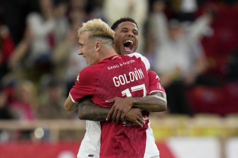 Monaco's Aleksandr Golovin celebrates with teammate Ismail Jakobs, right, after scoring his side's second goal during the French League One soccer match between AS Monaco and FC Metz, at the Stade Louis II in Monaco, Sunday, Oct. 22, 2023. (AP Photo/Daniel Cole)