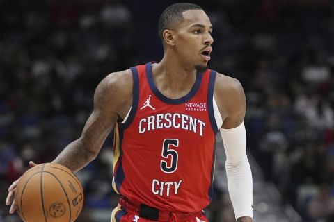 New Orleans Pelicans guard Dejounte Murray (5) moves the ball down court in the first half of an NBA basketball game against the Chicago Bulls in New Orleans, Wednesday, Oct. 23, 2024. (AP Photo/Gerald Herbert)