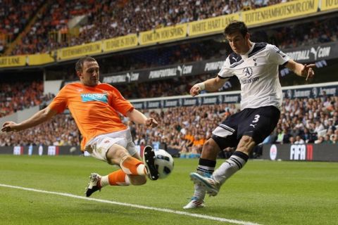 LONDON, UNITED KINGDOM - MAY 07:  Gareth Bale of Spurs has his effort stopped by Neal Eardley of Blackpool during the Barclays Premier League match between Tottenham Hotspur and Blackpool at White Hart Lane on May 7, 2011 in London, England.  (Photo by Scott Heavey/Getty Images)