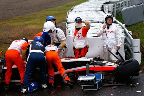 SUZUKA, JAPAN - OCTOBER 05:  Jules Bianchi of France and Marussia receives urgent medical treatment after crashing during the Japanese Formula One Grand Prix at Suzuka Circuit on October 5, 2014 in Suzuka, Japan.  (Photo by Getty Images/Getty Images)