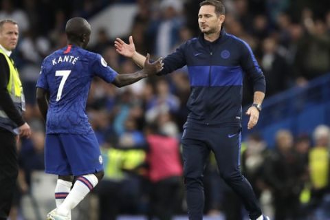 Chelsea's head coach Frank Lampard, right, salutes Chelsea's N'Golo Kante at the end of the British premier League soccer match between Chelsea and Liverpool, at the Stamford Bridge Stadium, London, Sunday, Sept. 22, 2019. (AP Photo/Matt Dunham)