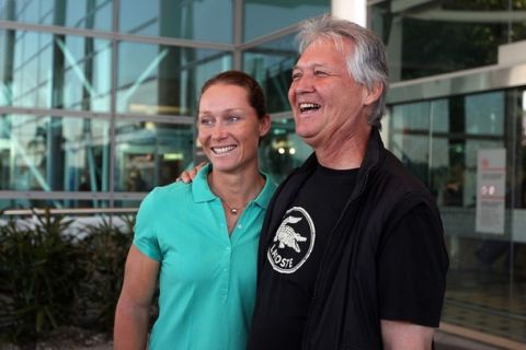 BRISBANE, AUSTRALIA - SEPTEMBER 17:  Australian US Open champion Sam Stosur is greeted by father Tony Stosur as she arrives home at Brisbane Airport on September 17, 2011 in Brisbane, Australia. Stosur won the 2011 US Open on Monday, beating Serena Williams of the United States.  (Photo by Chris Hyde/Getty Images)