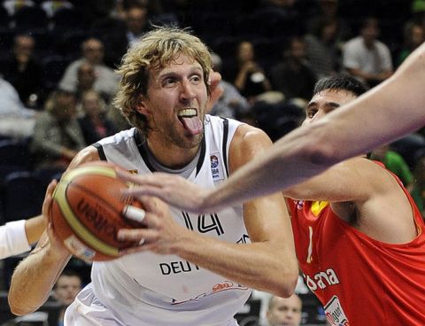 Dirk Nowitzki (R) of Germany vies with Fernando San Emeterio (R) of Spain during their Euro Basket 2011 group E second round qualification match between Spain and Germany in Vilnius on September 7, 2011.     AFP PHOTO/ JANEK SKARZYNSKI (Photo credit should read JANEK SKARZYNSKI/AFP/Getty Images)