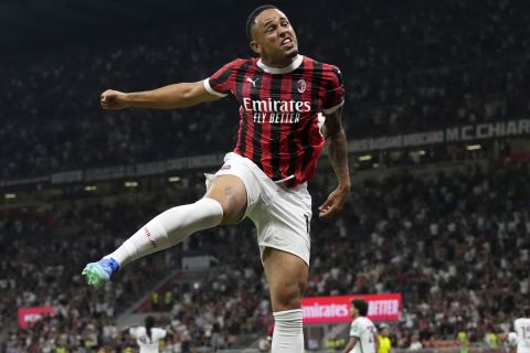 AC Milan's Noah Okafor celebrates after scoring his side's second goal during the Serie A soccer match between AC Milan and Torino at the San Siro stadium, in Milan, Italy, Saturday, Aug. 17, 2024. (AP Photo/Antonio Calanni)