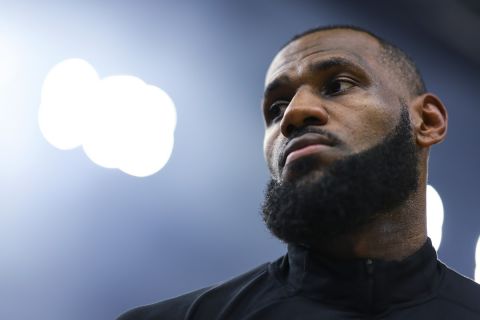 Los Angeles Lakers forward LeBron James waits for the team's NBA basketball game against the Minnesota Timberwolves on Saturday, Dec. 30, 2023, in Minneapolis. (AP Photo/Matt Krohn)