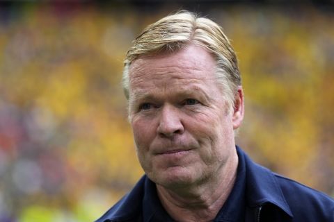 Netherlands head coach Ronald Koeman stands by the bench before a round of sixteen match between Romania and the Netherlands at the Euro 2024 soccer tournament in Munich, Germany, Tuesday, July 2, 2024. (AP Photo/Manu Fernandez)