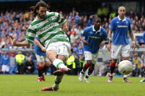 Celtic's Georgios Samaras takes a penalty kick which is saved by Rangers goalkeeper Allan McGregor during their Scottish Premier League 'Old Firm' soccer match at Ibrox Stadium in Glasgow, Scotland April 24, 2011. REUTERS/David Moir (BRITAIN - Tags: SPORT SOCCER)