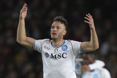 Napoli's Amir Rrahmani celebrates after scoring his side's opening goal during the Champions League, round of 16, second leg soccer match between Barcelona and SSC Napoli at the Olympic Lluis Companys stadium in Barcelona, Spain, Tuesday, March 12, 2024. (AP Photo/Emilio Morenatti)