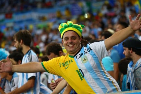 RIO DE JANEIRO, BRAZIL - JUNE 15: A fan enjoys the atmosphere prior to the 2014 FIFA World Cup Brazil Group F match between Argentina and Bosnia-Herzegovina at Maracana on June 15, 2014 in Rio de Janeiro, Brazil.  (Photo by Julian Finney/Getty Images)