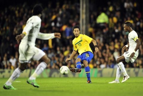 Brazil's midfielder Ronaldinho (C) passes the ball during the international friendly football match between Brazil and Ghana, at the Craven Cottage in London, on September 5, 2011. AFP PHOTO/GLYN KIRK (Photo credit should read GLYN KIRK/AFP/Getty Images)