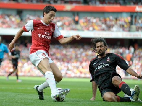Arsenal's Samir Nasri (L) competes with AC Milan's Mario Alberto Yepes during their Emirates Cup football match at Emirates Stadium in London, England on July 31, 2010.  AFP PHOTO/Olly Greenwood

FOR EDITORIAL USE ONLY Additional license required for any commercial/ promotional use or use on TV or internet (except identical online version of newspaper) of Premier League/Football photos. Tel DataCo  
+44 207 2981656. Do not alter/modify photo. (Photo credit should read OLLY GREENWOOD/AFP/Getty Images)(Photo Credit should Read /AFP/Getty Images)