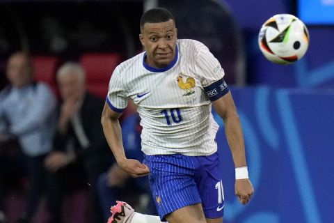 Kylian Mbappe of France controls the ball during a Group D match between Austria and France at the Euro 2024 soccer tournament in Duesseldorf, Germany, Monday, June 17, 2024. (AP Photo/Alessandra Tarantino)