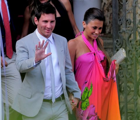 Barcelona's foward Lionel Messi and his girlfriend Antonella Roccuzzo arrive for the wedding ceremony of Spain's midfielder Andres Iniesta in Altafulla, near Tarragona on July 8, 2012. AFP PHOTO/ JOSEP LAGO