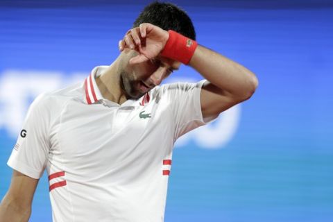 Novak Djokovic of Serbia reacts during the Serbia Open tennis tournament match against Aslan Karatsev of Russia, in Belgrade, Serbia, Saturday, April 24, 2021. (AP Photo/Darko Vojinovic)