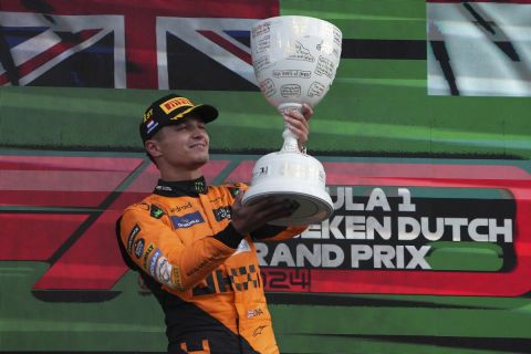 McLaren driver Lando Norris of Britain celebrates after winning the Formula One Dutch Grand Prix race at the Zandvoort racetrack, Netherlands, Sunday, Aug. 25, 2024. (AP Photo/Peter Dejong)