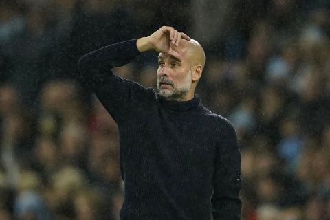 Manchester City's head coach Pep Guardiola gestures during the English Premier League soccer match between Manchester City and Tottenham at the Etihad Stadium in Manchester, England, Sunday, Nov. 24, 2024. (AP Photo/Dave Thompson)