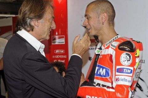 Ducati MotoGP rider Valentino Rossi (R) of Italy talks with Ferrari Chief Executive Luca Cordero di Montezemolo at the qualifying session for the Italian motorcycling Grand Prix at the Mugello circuit July 2, 2011. The race will take place on Sunday. REUTERS/Milagro/Handout (ITALY - Tags: SPORT MOTOR RACING) FOR EDITORIAL USE ONLY. NOT FOR SALE FOR MARKETING OR ADVERTISING CAMPAIGNS. THIS IMAGE HAS BEEN SUPPLIED BY A THIRD PARTY. IT IS DISTRIBUTED, EXACTLY AS RECEIVED BY REUTERS, AS A SERVICE TO CLIENTS