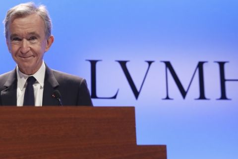 CEO of LVMH Bernard Arnault smiles as he arrives to present the group's 2018 results during a conference in Paris, Tuesday, Jan. 29, 2019. (AP Photo/Christophe Ena)