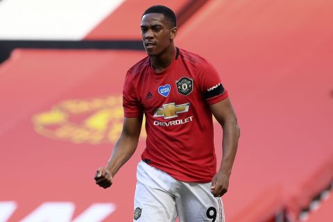 Manchester United's Anthony Martial celebrates after scoring the opening goal of his team during the English Premier League soccer match between Manchester United and Sheffield United at Old Trafford in Manchester, England, Wednesday, June 24, 2020. (Michael Regan/Pool via AP)