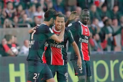 Paris Saint-Germain's Nene, center, celebrates after scoring during his League One soccer match against Dijon, in Paris, Sunday Oct. 23, 2011. (AP Photo/Thibault Camus)