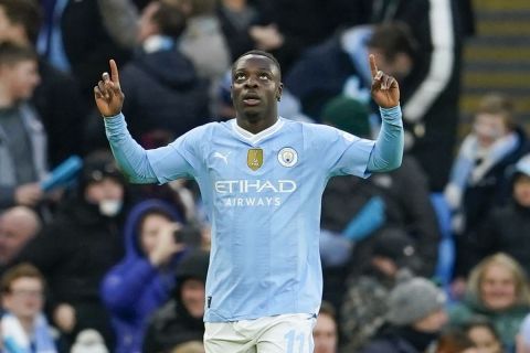 Manchester City's Jeremy Doku celebrates after scoring his side's fifth goal during the English FA Cup third round soccer match between Manchester City and Huddersfield Town, at the Etihad stadium in Manchester, England, Sunday, Jan. 7, 2024. (AP Photo/Dave Thompson)