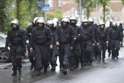 Riot police walk on the street ahead the Group C match between Serbia and England at the Euro 2024 soccer tournament in Gelsenkirchen, Germany, Sunday, June 16, 2024. (AP Photo/Markus Schreiber)