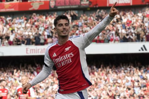 Arsenal's Kai Havertz celebrates after scoring his side's opening goal during the English Premier League soccer match between Arsenal and Wolverhampton Wanderers at Emirates Stadium in London, England, Saturday, Aug. 17, 2024. (AP Photo/Frank Augstein)