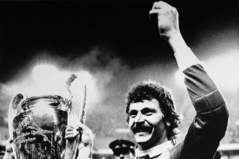 FILE - Steaua Bucharest goalkeeper Helmuth Duckadam raises the European Champions Cup after the Romainian team defeated Barcelona in penalties in Seville, Spain, May 7, 1986. When it comes to European soccer, nothing quite compares to Romanian club Steaua Bucharest going on a 119-match unbeaten run domestically from 1986-89. During that run, Steaua also won the European Cup in 1986 against FC Barcelona. (AP Photo/Fernando Ricardo, File)