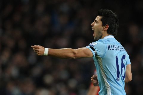 Manchester City's Argentinian footballer Sergio Aguero celebrates scoring his team's first goal against Liverpool during their English Premier League football match in Manchester, north-west England on January 3, 2012. AFP PHOTO/PAUL ELLIS
RESTRICTED TO EDITORIAL USE. No use with unauthorized audio, video, data, fixture lists, club/league logos or live services. Online in-match use limited to 45 images, no video emulation. No use in betting, games or single club/league/player publications. (Photo credit should read PAUL ELLIS/AFP/Getty Images)