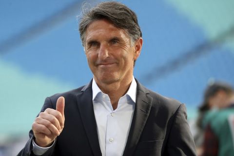 Berlin coach Bruno Labbadia gestures as he arrives for the German Bundesliga soccer match between RB Leipzig and Hertha BSC at the Red Bull Arena in Leipzig, Germany, Wednesday, May 27, 2020. The German Bundesliga is the world's first major soccer league to resume after a two-month suspension because of the coronavirus pandemic. (Alexander Hassenstein/Pool via AP)