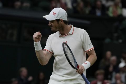 Britain's Andy Murray celebrates winning a point against Germany's Oscar Otte during the men's singles second round match on day three of the Wimbledon Tennis Championships in London, Wednesday June 30, 2021. (AP Photo/Alastair Grant)