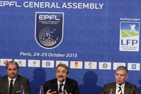 Chairman of the European Professional Football Leagues (EPFL) Frederic Thiriez, center, with EPFL chief executive officer Emanuel Macedo de Medeiros, left, and EPFL deputy chairman Frank Rutten, right, address reporters during a press conference held in Paris, Friday Oct. 25, 2013, at the end of the EPFL general assembly.(AP Photo/Remy de la Mauviniere)