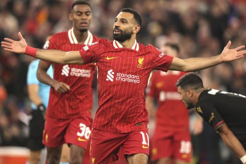 Liverpool's Mohamed Salah celebrates after scoring his side's second goal during the Champions League soccer match between Liverpool and Bologna at the Anfield stadium in Liverpool, England, Wednesday, Oct. 2, 2024. (AP Photo/Ian Hodgson)