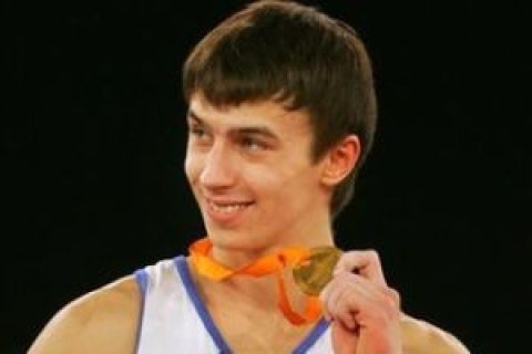 New European Champion men individual allround Maxim Deviatovski of Russia, shows his gold medal during the award ceremony of the European Championships Artistic Gymnastics in Amsterdam, Netherlands, Saturday April 28, 2007. Fabian Hambuechen of Germany won silver, Yuri Ryazanov of Russia bronze. (AP Photo/Peter Dejong) 