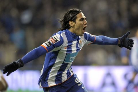 FC Porto's Colombian forward Radamel Falcao celebrates scoring during the Portuguese super league football match opposing FC Porto and Vitoria SC at the Dragao Stadium in Porto on March 5, 2011.  AFP PHOTO / MIGUEL RIOPA (Photo credit should read MIGUEL RIOPA/AFP/Getty Images)