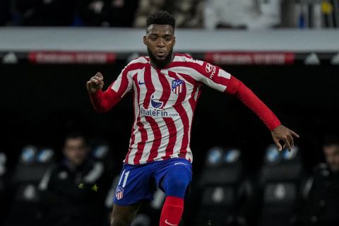 Atletico Madrid's Thomas Lemar plays the ball during the Spanish Copa del Rey quarter-final soccer match between Real Madrid and Atletico Madrid at Santiago Bernabeu stadium in Madrid, Thursday, Jan. 26, 2023. (AP Photo/Bernat Armangue)