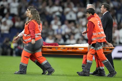 Real Madrid's Dani Carvajal is carried off the pitch during the La Liga soccer match between Real Madrid and Villareal in Madrid, Spain, on Saturday, Oct. 5, 2024. (AP Photo/Bernat Armangue)